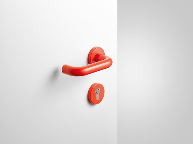 Lever handle with key rosette in the colour coral made of polyamide