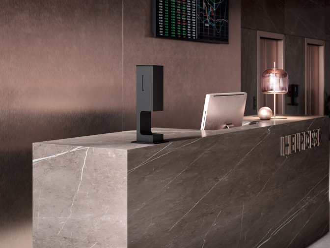 Modern reception counter with a touch-free disinfectant dispenser in matt black stainless steel