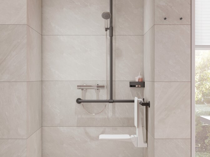 Shower area equipped with an infinitely adjustable magnetic shower holder